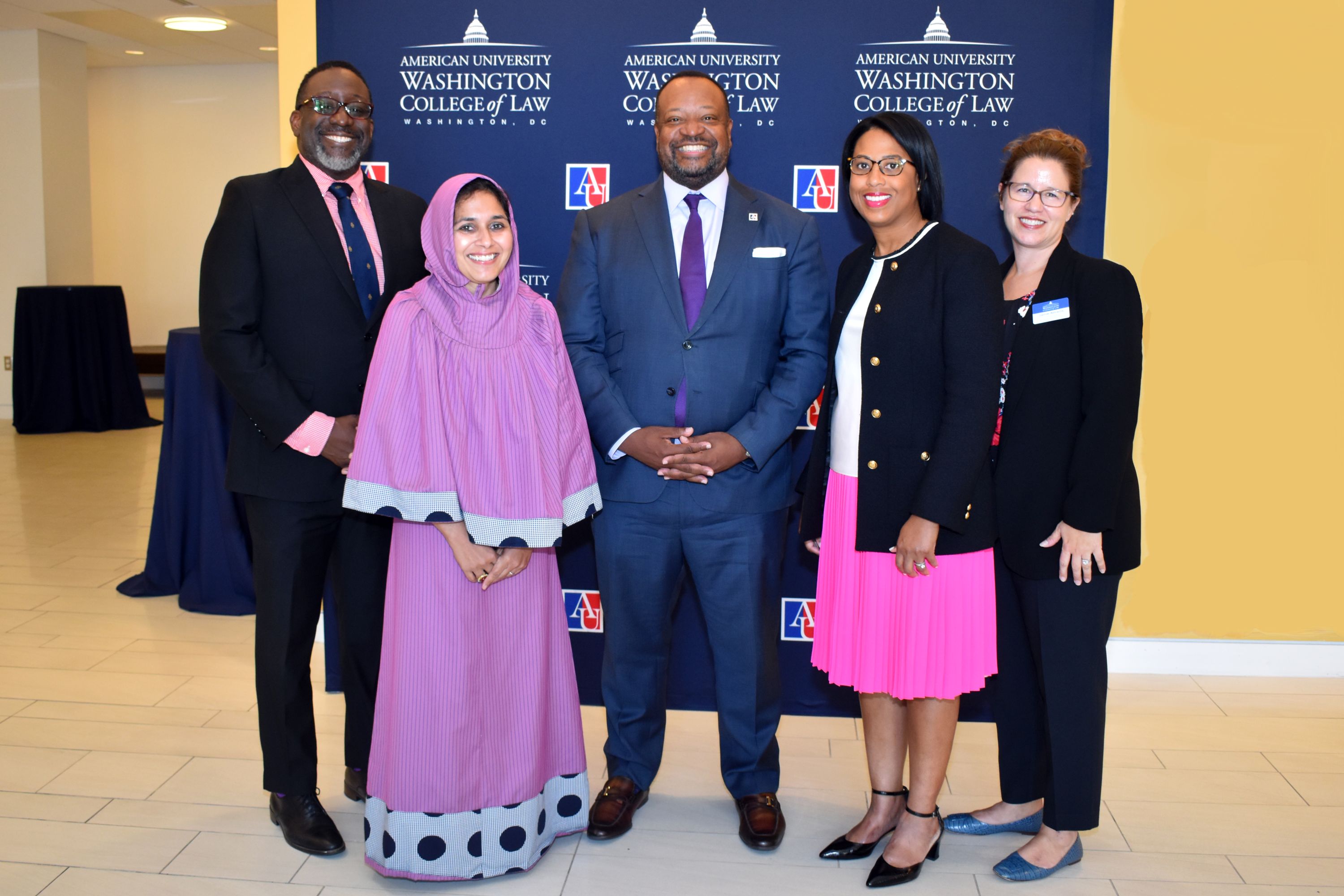Judge Zubari Williams '03 (left), Fatema Merchant '08 (second from left), Dean Roger A. Fairfax Jr. (middle), Erica Gerson '04 (second from right), and Jamie Abrams '02 (right)