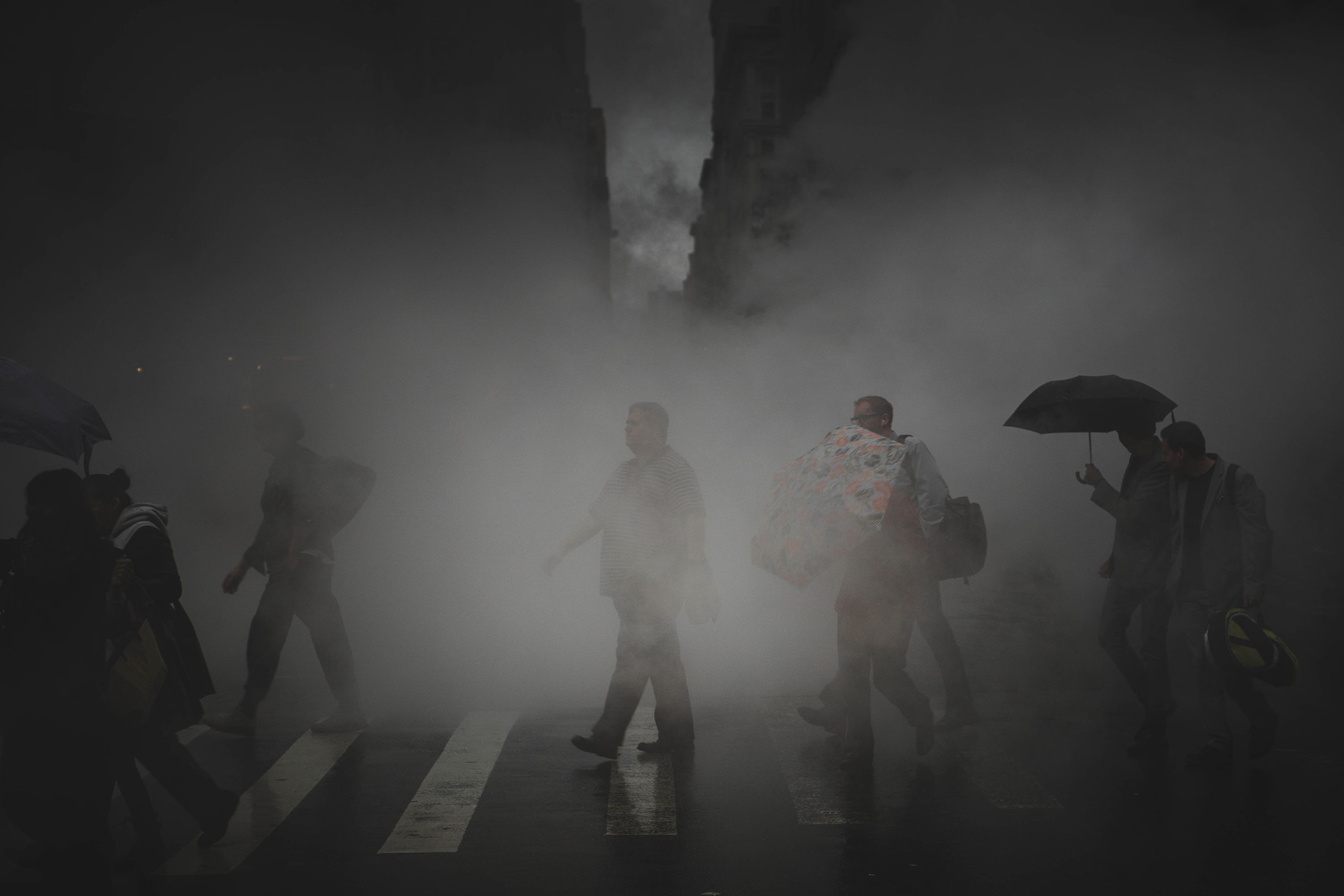 people walking across street covered in toxic pollution