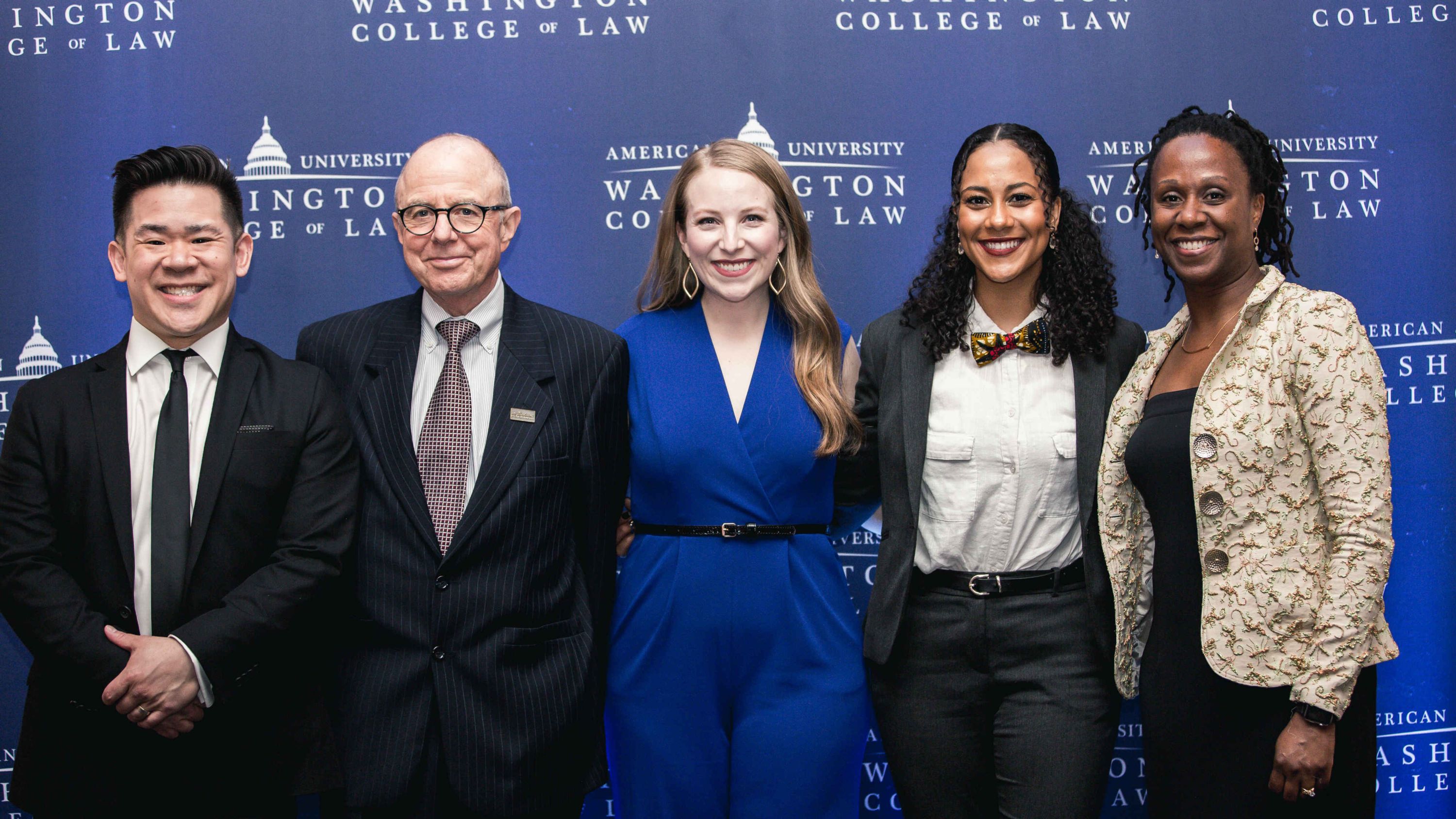 Incoming Myers Society Chair Eric Huang ’05, current Myers Society Chair Tom Morante ’77, Myers Law Scholarship recipient Stephanie M. Daigle, AUWCL Dean Camille Nelson, and Myers Law Scholarship recipient Lisa Ndembu