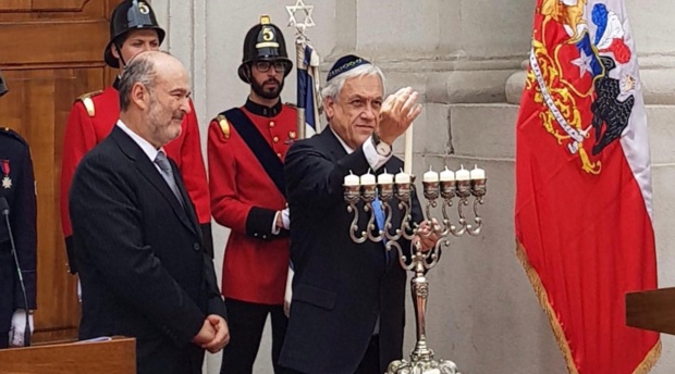 President of Chile Sebastián Piñera lights menorah during the event.