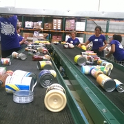 Sorting canned goods at Capital Area Food Bank