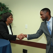 Judge Donald shakes hands with BLSA president