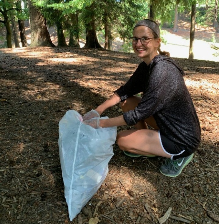 Student volunteer cleaning up trash