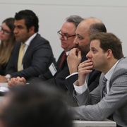 Symposium attendees during a presentation