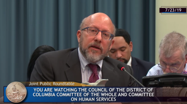 Robert Dinerstein testifying during D.C. Council hearing 