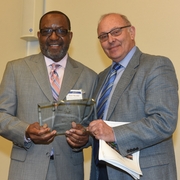 Dean Claudio Grossman presents Kojo Nnamdi with the North Star Award