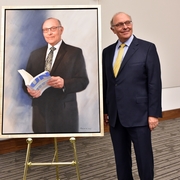 Dean Claudio Grossman with his official portrait.