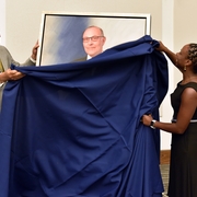DAC Chair Ken Lore and Dean Nelson unveil the official portrait.