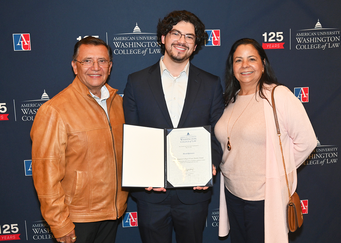 David Quintero with his parent