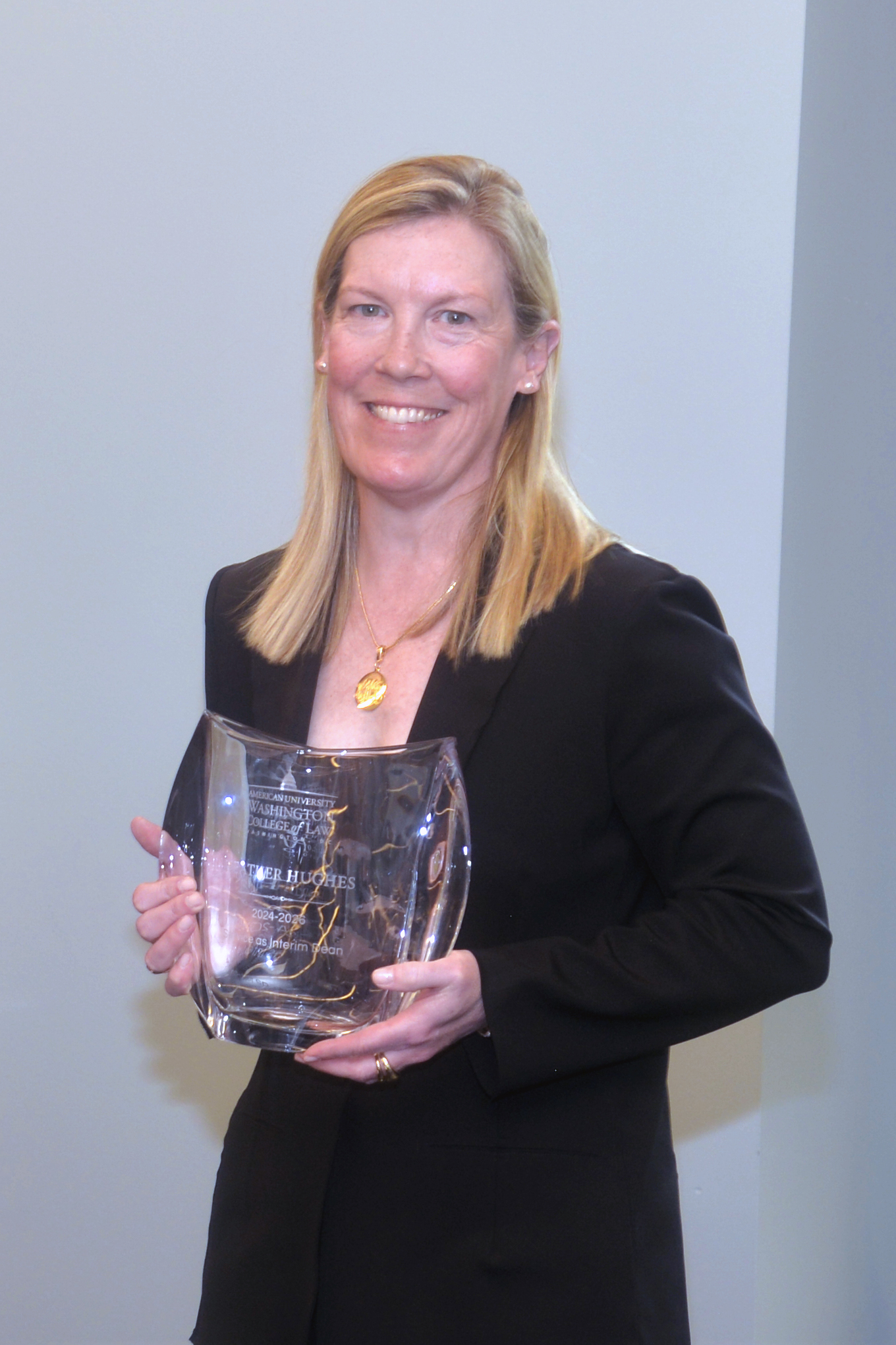 Interim Dean Heather Hughes with her service recognition award.