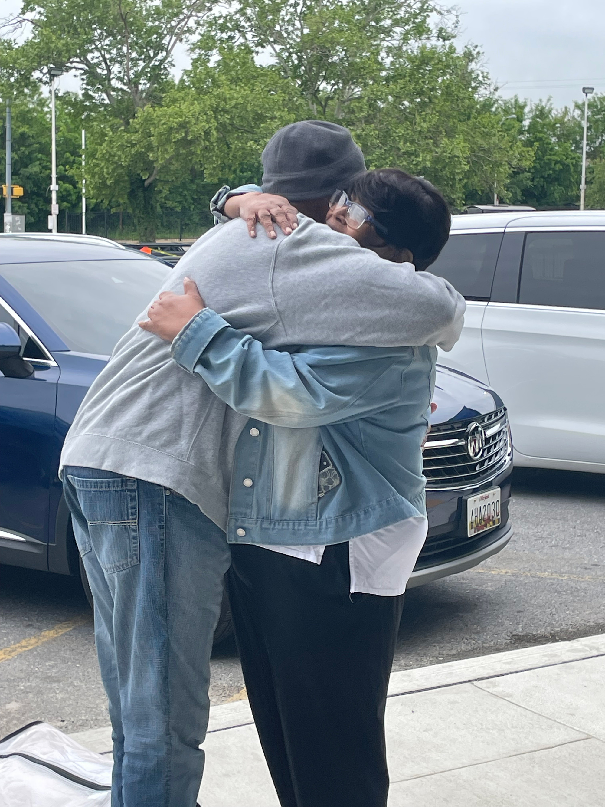 Ella Kruczynska's client higs his mother following his release from prison. Ella Kruczynska's client higs his mother following his release from prison.
