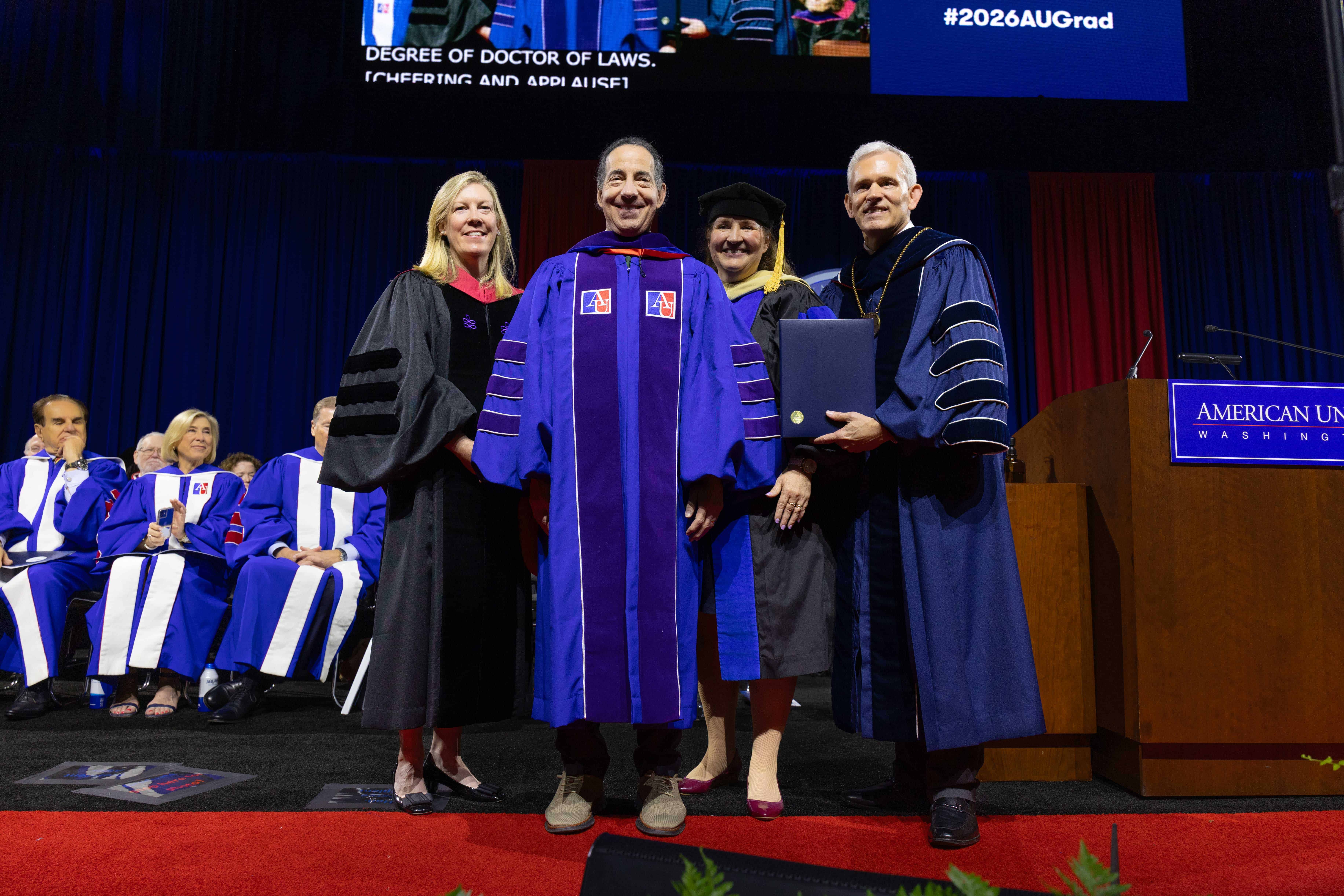 Jamie Raskin getting robed after receiving his honorary degree.