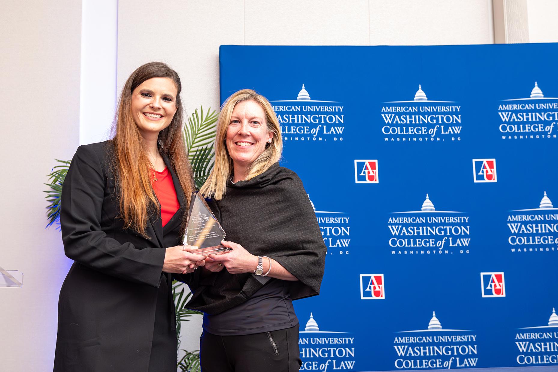 Outstanding Graduate of the Last Decade Awardee Elizabeth "Lizzie" Lewis (left) and Interim Dean Heather Hughes Outstanding Graduate of the Last Decade Awardee Elizabeth "Lizzie" Lewis (left) and Interim Dean Heather Hughes